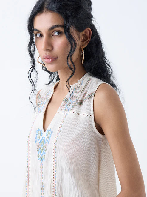 Graceful Women Off White Embroidered Cotton Top for Casual and Festive Wear