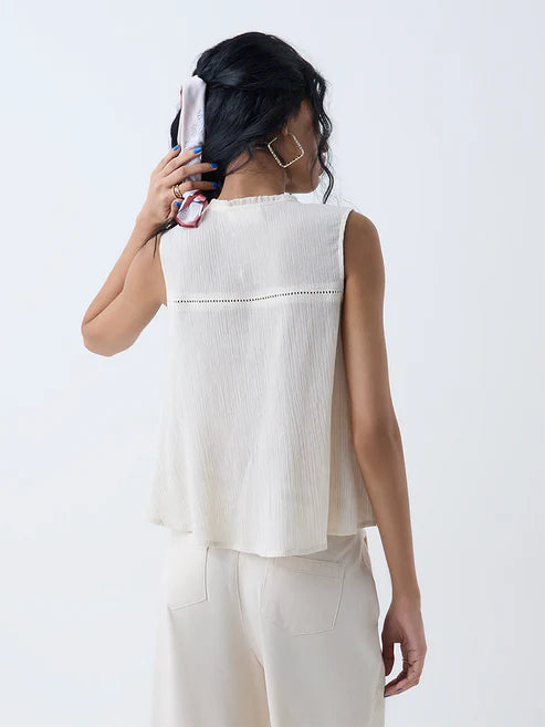 Graceful Women Off White Embroidered Cotton Top for Casual and Festive Wear