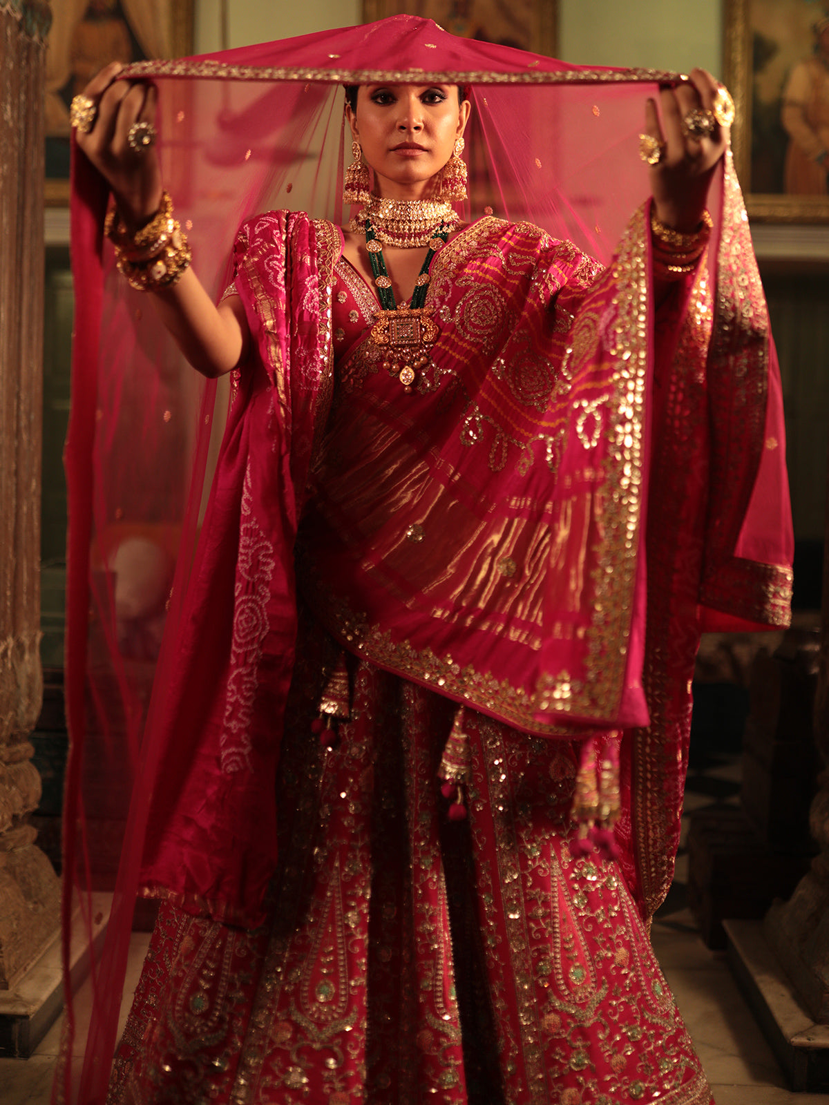 Designer Rani Color Raw Silk Lehenga Choli with Traditional Detailing for Brides and Special Events