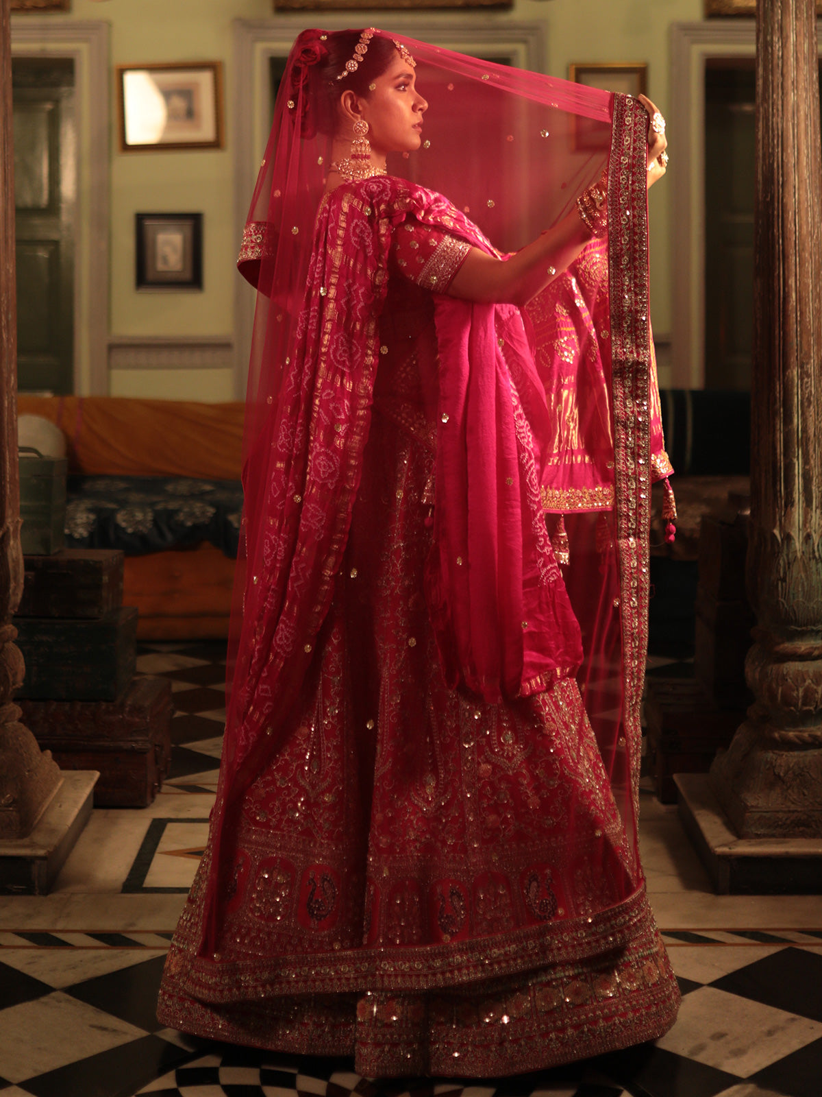 Designer Rani Color Raw Silk Lehenga Choli with Traditional Detailing for Brides and Special Events