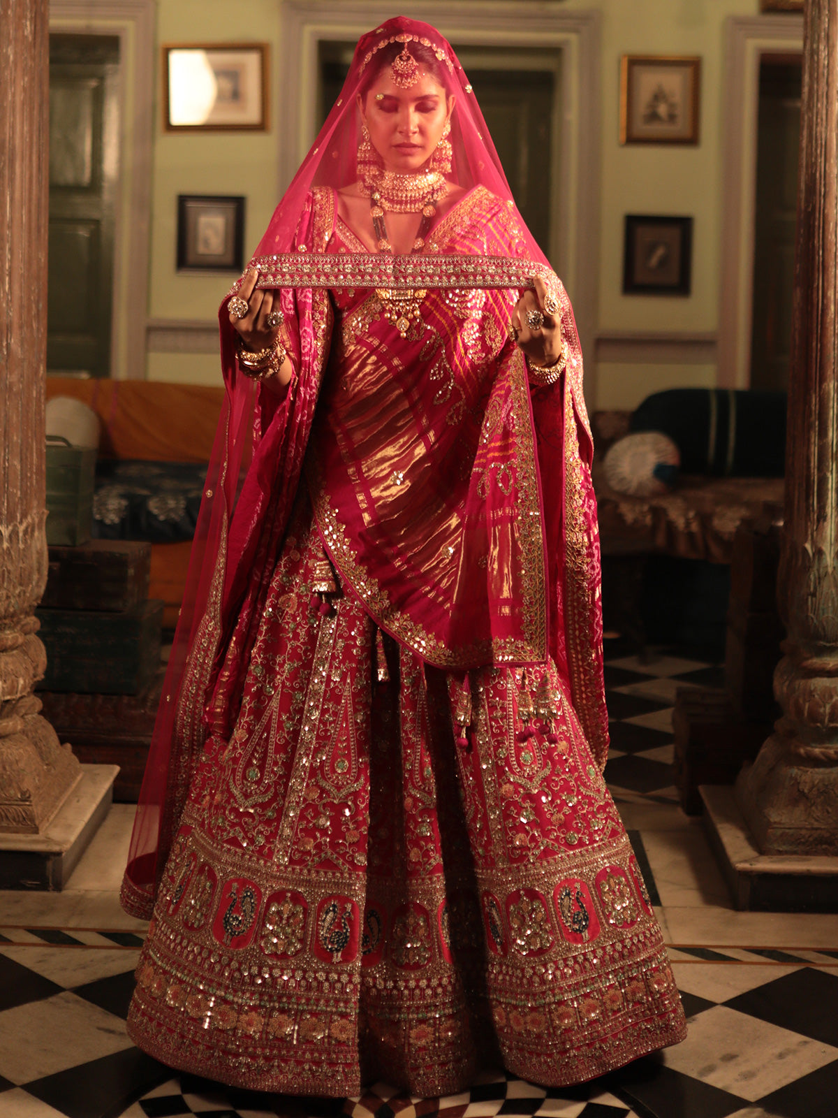 Designer Rani Color Raw Silk Lehenga Choli with Traditional Detailing for Brides and Special Events