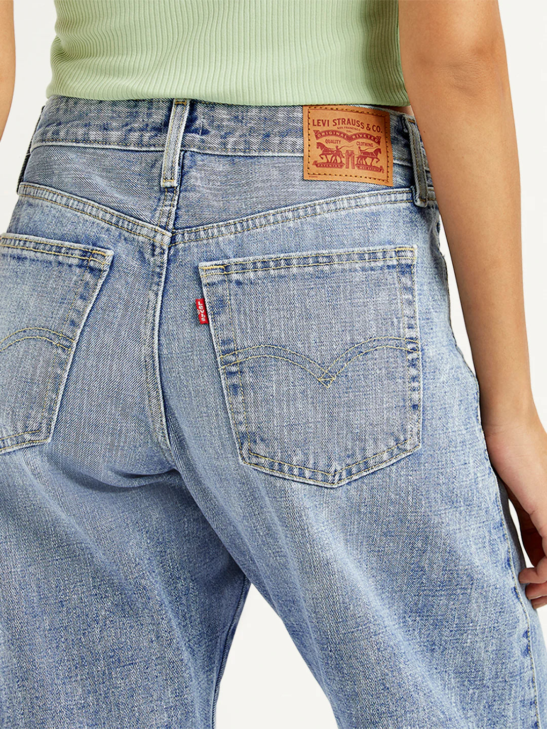 Relaxed Womens Light Blue Baggy Dad Jeans with Mid Rise Waist and Barrel Fit Perfect for Travel and Lounge